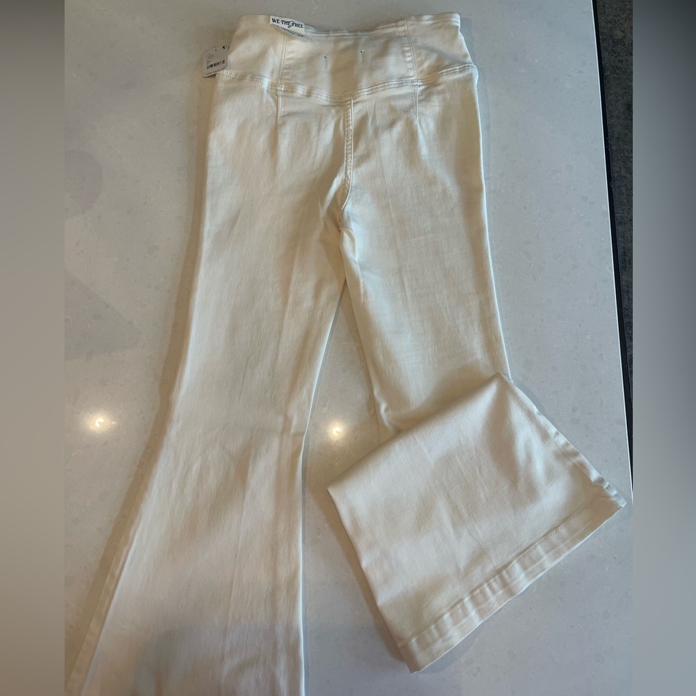Free People cream colored stretchy pants.